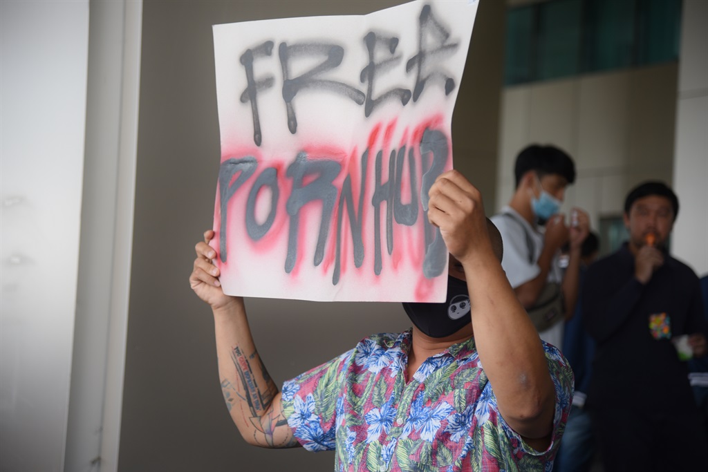 A protester holds a placard during a demonstration following the blocking of the adult website Pornhub outside the Ministry of Digital Economy and Society in Bangkok.