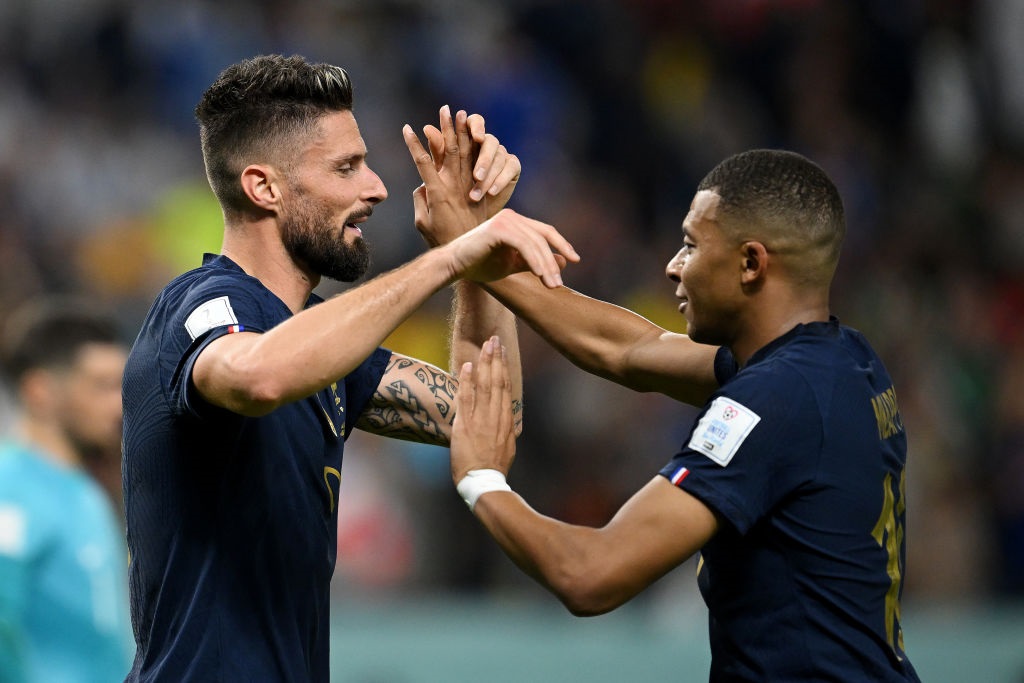 AL WAKRAH, QATAR - NOVEMBER 22: Olivier Giroud of France celebrates with Kylian Mbappe after scoring their teams fourth goal during the FIFA World Cup Qatar 2022 Group D match between France and Australia at Al Janoub Stadium on November 22, 2022 in Al Wakrah, Qatar. (Photo by Clive Mason/Getty Images)