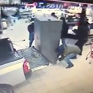 Five armed thieves load an entire ATM onto a small getaway bakkie. (YouTube screen grab)