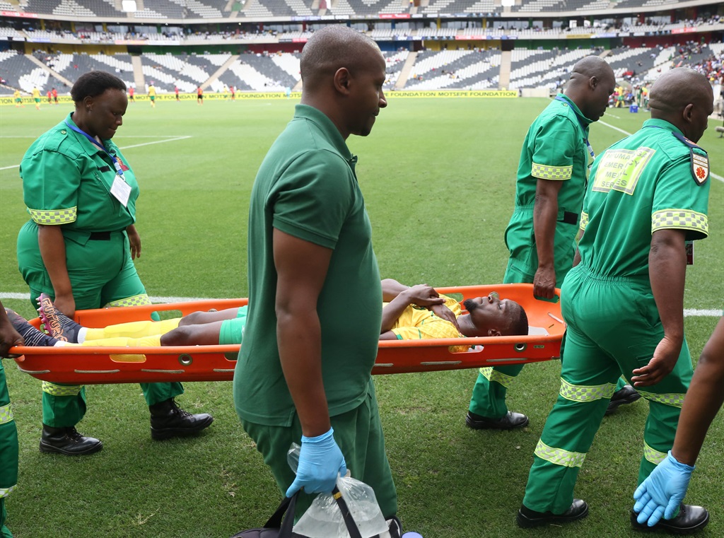 Siyanda Xulu of South Africa injured during the 2022 International Friendly match between South Africa and Angola at Mbombela Stadium in Nelspruit on 20 November 2022 © Samuel Shivambu/BackpagePix