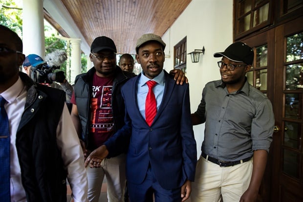 MDC opposition leader Nelson Chamisa arrives at the Bronte
Hotel in Harare for a press conference minutes after he was broken up by
several dozen riot police armed with tear gas cannisters, as Zimbabwe's
opposition rejected today what it said were the "fake" results of
landmark elections. 

