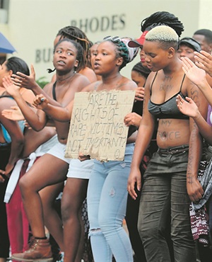 Rhodes University students bare their breasts in protest against sexual violence. Picture: Gallo images/File