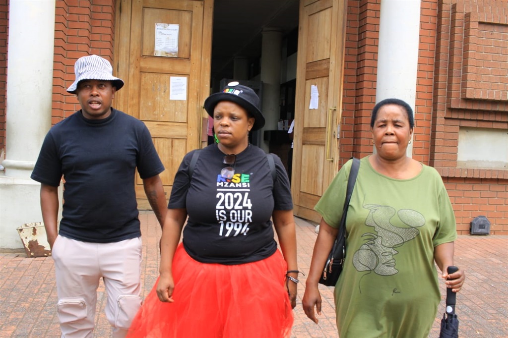 Former Orlando Pirates star Bennet Chenene, his mother Nthabiseng Chenene, and Lerato Mahoyi leaving the Vereeniging Magistrates Court. Photo by Tumelo Mofokeng