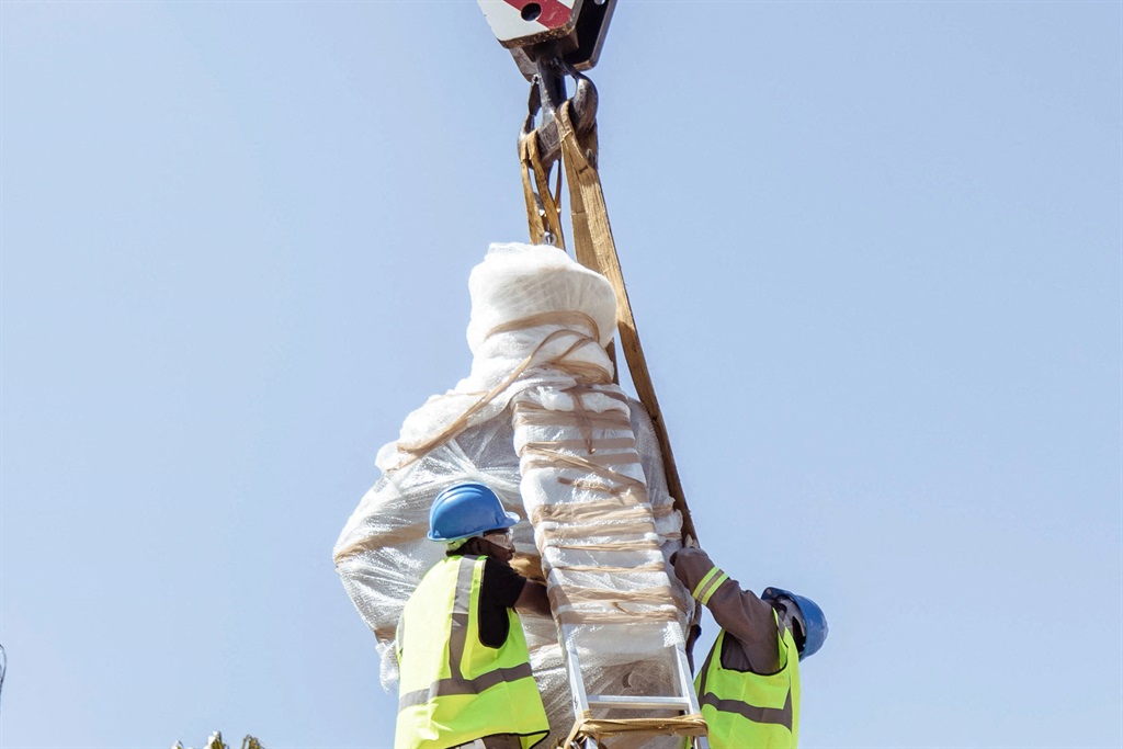 Workers prepare to remove the statue of German colonial leader Curt von Francois in Windhoek on November 23, 2022. The statue of a German colonial leader Curt von Francois in Namibia's capital was on November 23, 2022 taken down following local activists piling pressure on city authorities. Photo: Julia Runge / AFP