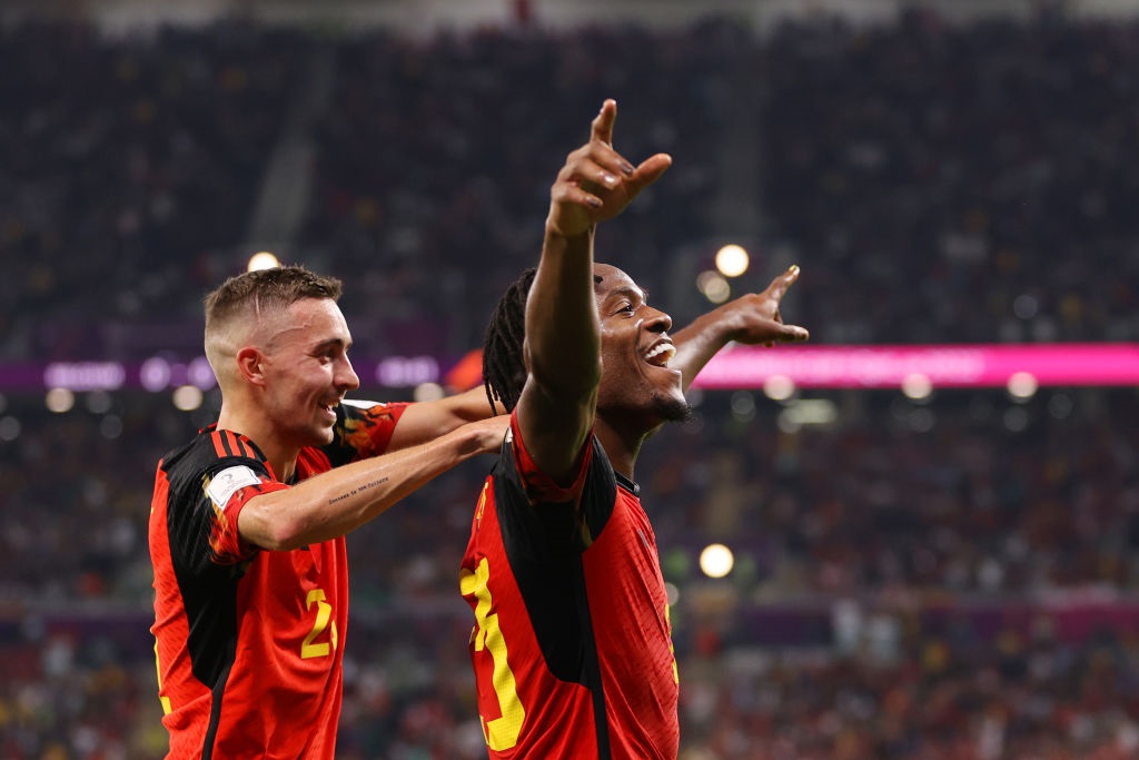 DOHA, QATAR - NOVEMBER 23: Michy Batshuayi of Belgium celebrates scoring their first goal with their teammate Timothy Castagne during the FIFA World Cup Qatar 2022 Group F match between Belgium and Canada at Ahmad Bin Ali Stadium on November 23, 2022 in Doha, Qatar. (Photo by Clive Brunskill/Getty Images)