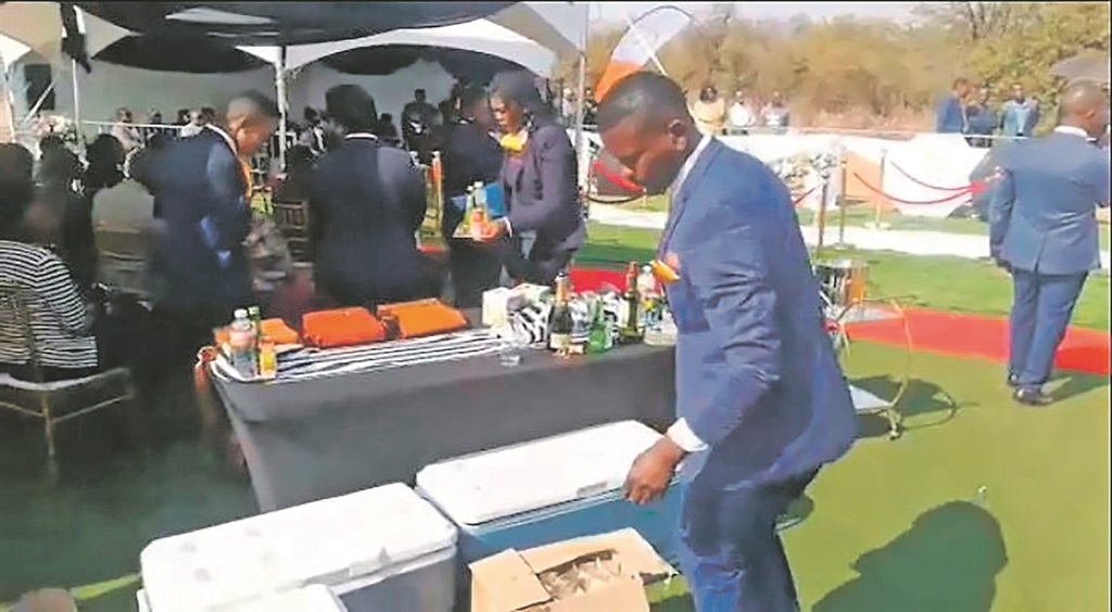 Mourners were served whisky and champagne while they waited for the priest to finish the service. 
