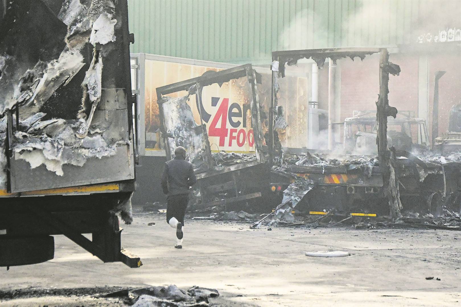 HamstrungTrucks that were burnt in a depot in the Sea Cow Lake area during the riots in July last year.A considerable number of shops and businesses were looted and/or torched across the country during the wave of violent protests that followed the incarceration offormer president Jacob Zuma. Photo: Darren stewart / gallo images