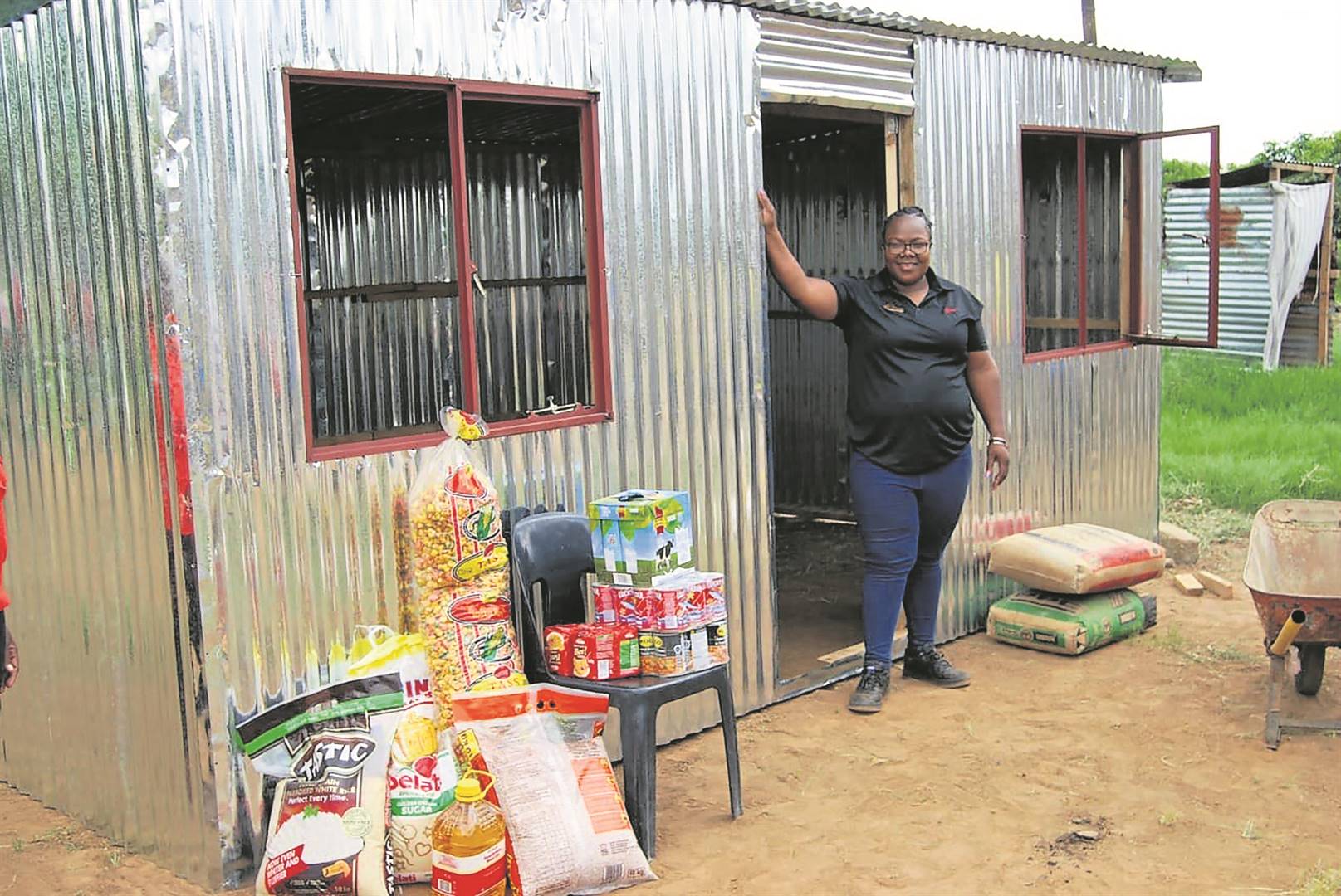 Grace Malaudzi opened her heart and together with her colleagues managed to donate a shack and groceries to gogo Pauline Sithole.   Photo by Raymond Morare