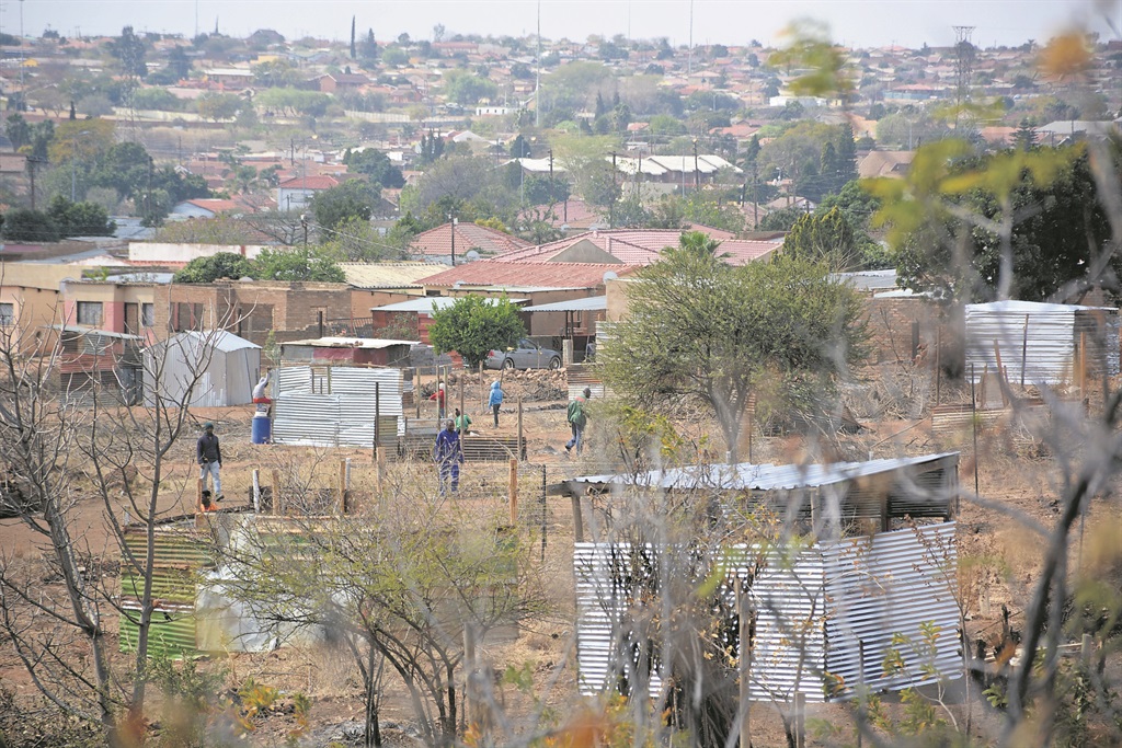 People who live in Morula View, Mabopane, Tshwane are furious that land grabbers have built shacks next to their bonded houses.            Photo by Morapedi Mashashe