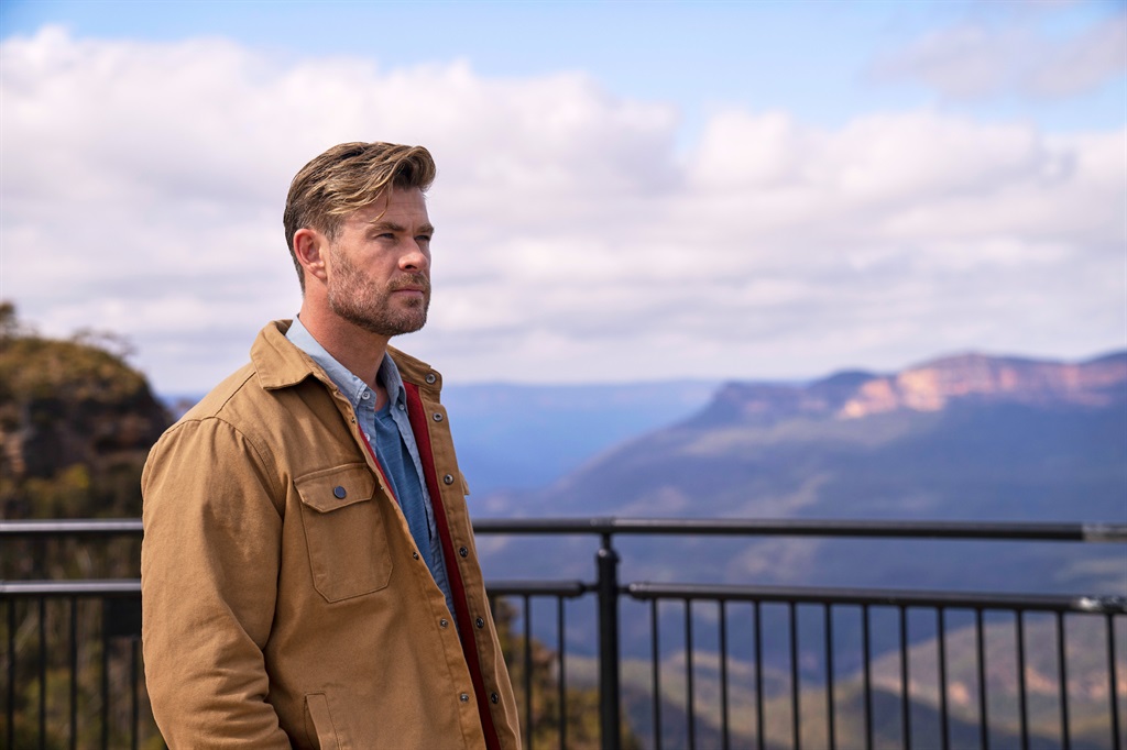 Chris Hemsworth gazes out over a canyon. (National Geographic for Disney+/Craig Parry)