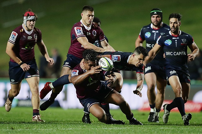 Reds hooker Brandon Paenga-Amosa and Rebels flyhalf Matt Toomua compete for the ball during the Super Rugby AU encounter at Brookvale Oval on 10 July 2020. 