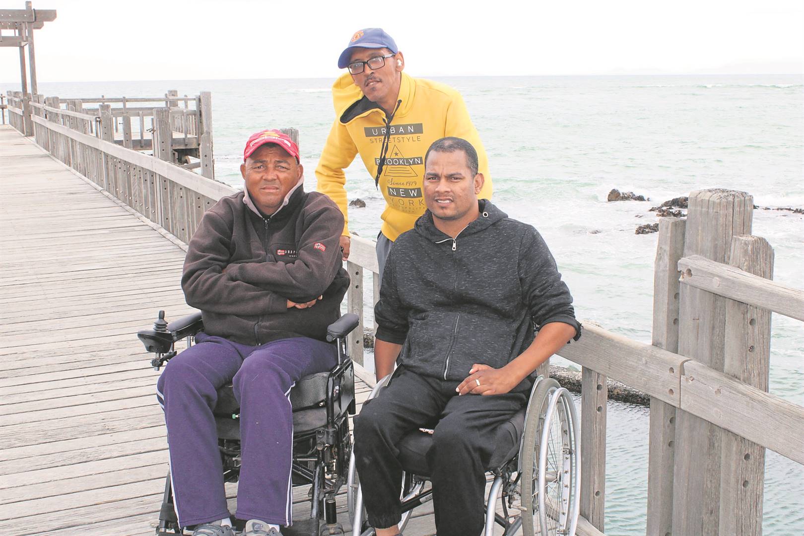 Jozua Julies, Edgar Hartnick and their assistant Adrian du Plessis at the pier at Harmony Park, where they are expected to participate in an awareness campaign to prevent diving accidents.Photo: Yaseen Gaffar