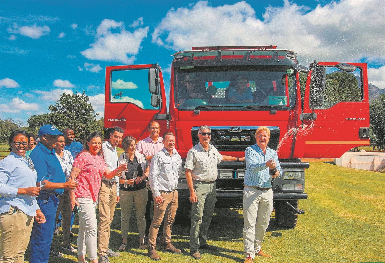 Vergelegen managing director Wayne Coetzer and members of the estate, garden and vineyard departments celebrate the arrival of the new firefighting truck. 