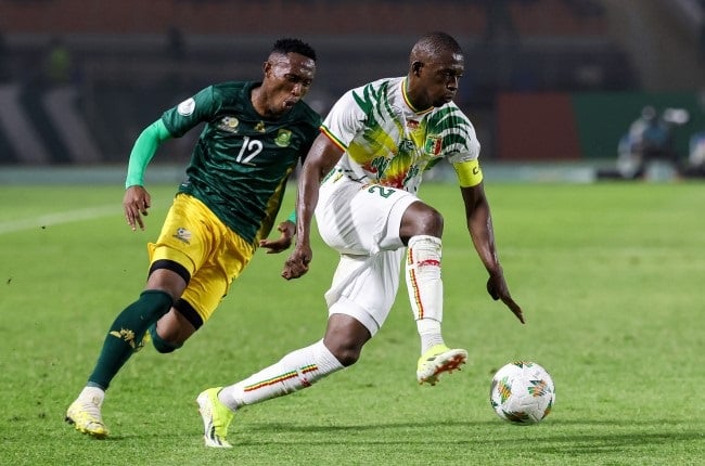 Mali's defender #2 Hamari Traore (R) fights for the ball with South Africa's defender #12 Thapelo Maseko during the Africa Cup of Nations group E match between Mali and South Africa at Amadou Gon Coulibaly Stadium in Korhogo. (Photo by Fadel Senna / AFP)