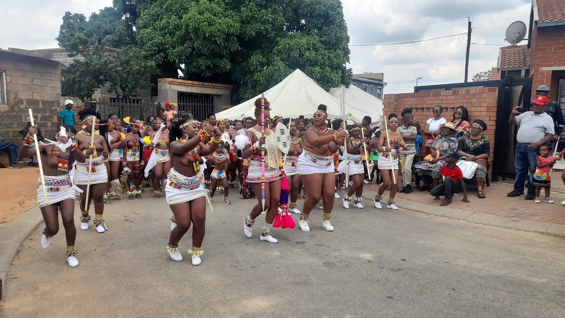 Zodwa Kambule (middle) celebrating her coming of age with fellow members of Qhakaza Tshitshi.