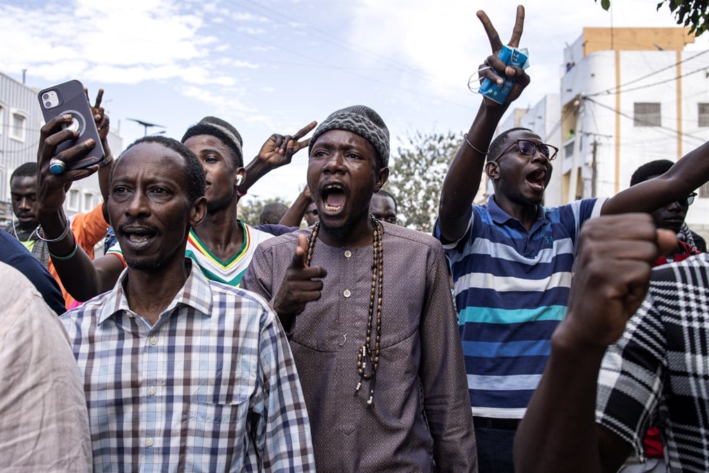 Protesters shouted as they demonstrated during a march, calling on authorities to respect the election date in Dakar on 16 February 2024.