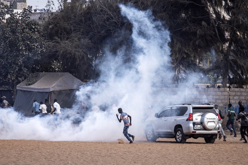 Protesters ran from teargas during a march calling