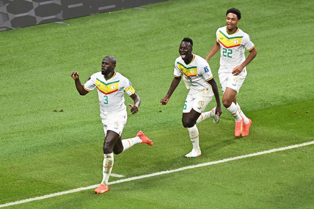 DOHA, QATAR - NOVEMBER 29: Kalidou Koulibaly of Senegal celebrates with teammates after scoring their teamâ??s second goal during the FIFA World Cup Qatar 2022 Group A match between Ecuador and Senegal at Khalifa International Stadium on November 29, 2022 in Doha, Qatar. (Photo by Clive Mason/Getty Images)