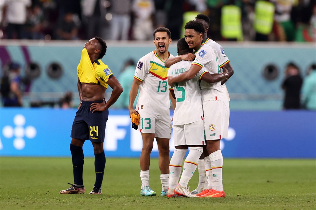 Iliman Ndiaye of Senegal celebrates with teammates after their sides victory during the FIFA World Cup Qatar 2022 Group A match between Ecuador and Senegal at Khalifa International Stadium in Doha, Qatar. Photo: Ryan Pierse/Getty Images