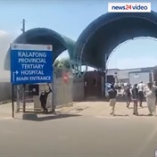 Striking Kalafong hospital staff barricade road, trash health facility