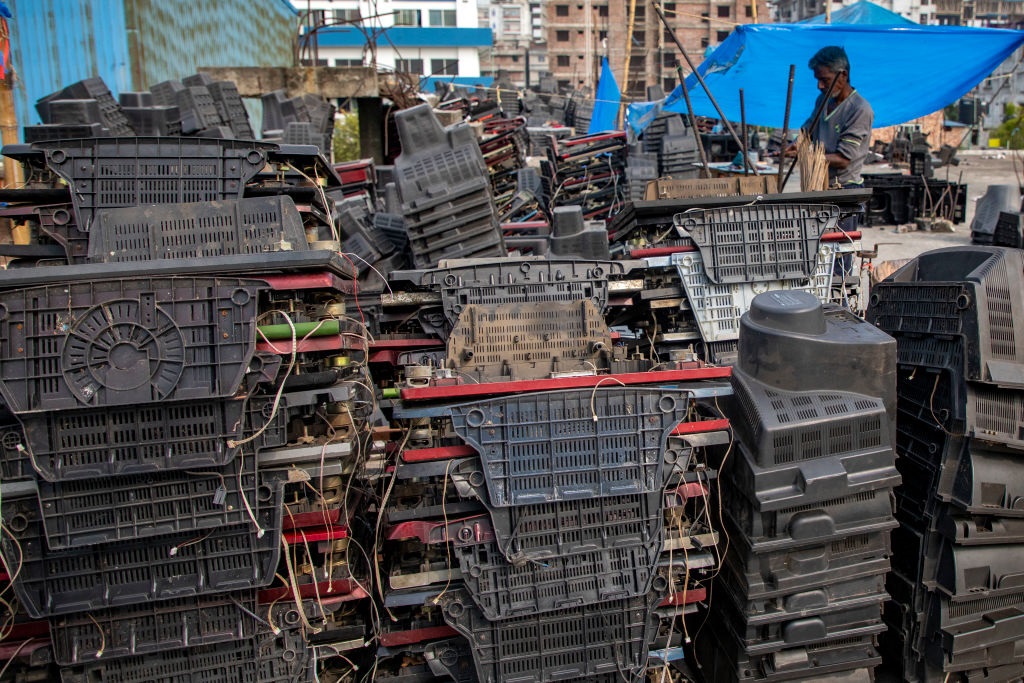 A man is seen working at a TV recycling scrap yard which is considered as e-waste in Dhaka, Bangladesh on October 30, 2022.