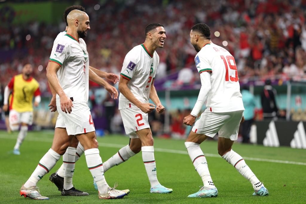 DOHA, QATAR - DECEMBER 01: Youssef En-Nesyri (R) of Morocco celebrates after scoring the teams first goal with teammates during the FIFA World Cup Qatar 2022 Group F match between Canada and Morocco at Al Thumama Stadium on December 01, 2022 in Doha, Qatar. (Photo by Richard Heathcote/Getty Images)