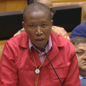 Julius Malema posing a question in Parliament
