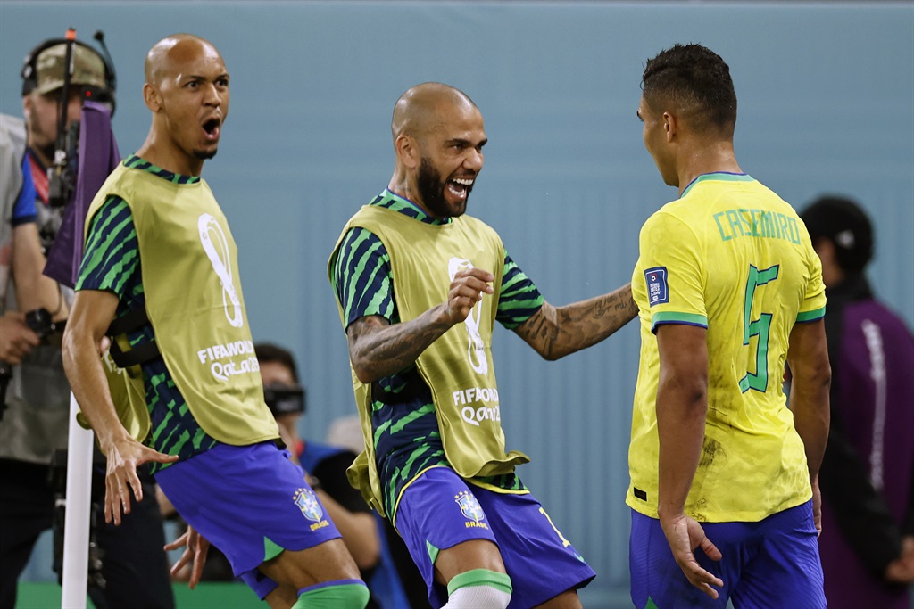 Dani Alves, centre, and Fabinho are about to embrace Casemiro who scored Brazil's winning goal against Switzerland. Photo: ANP via Getty Images
