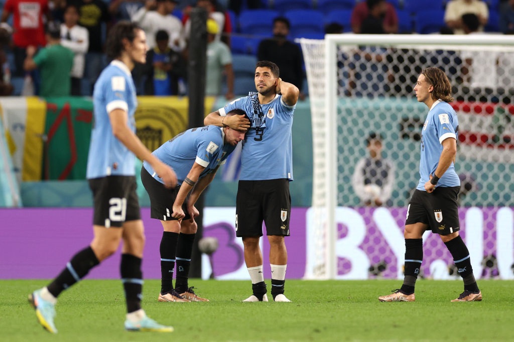 Luis Suarez of Uruguay looks dejected after their sides elimination from the FIFA World Cup (Photo by Elsa/Getty Images)
