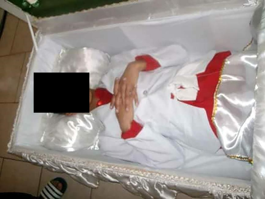 The Pupil poses inside a coffin. Photo from Facebook.
