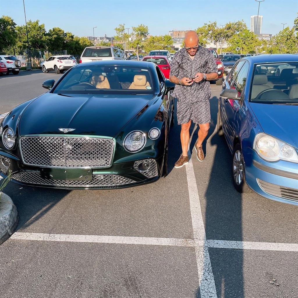 Dino Ndlovu alongside his pricey Bentley ride.
