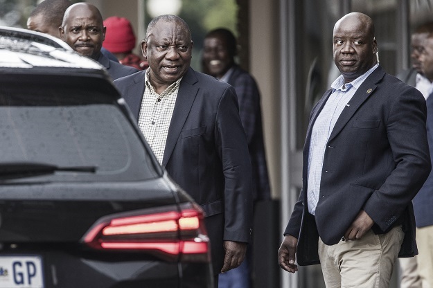 South African President Cyril Ramaphosa (C) leaves