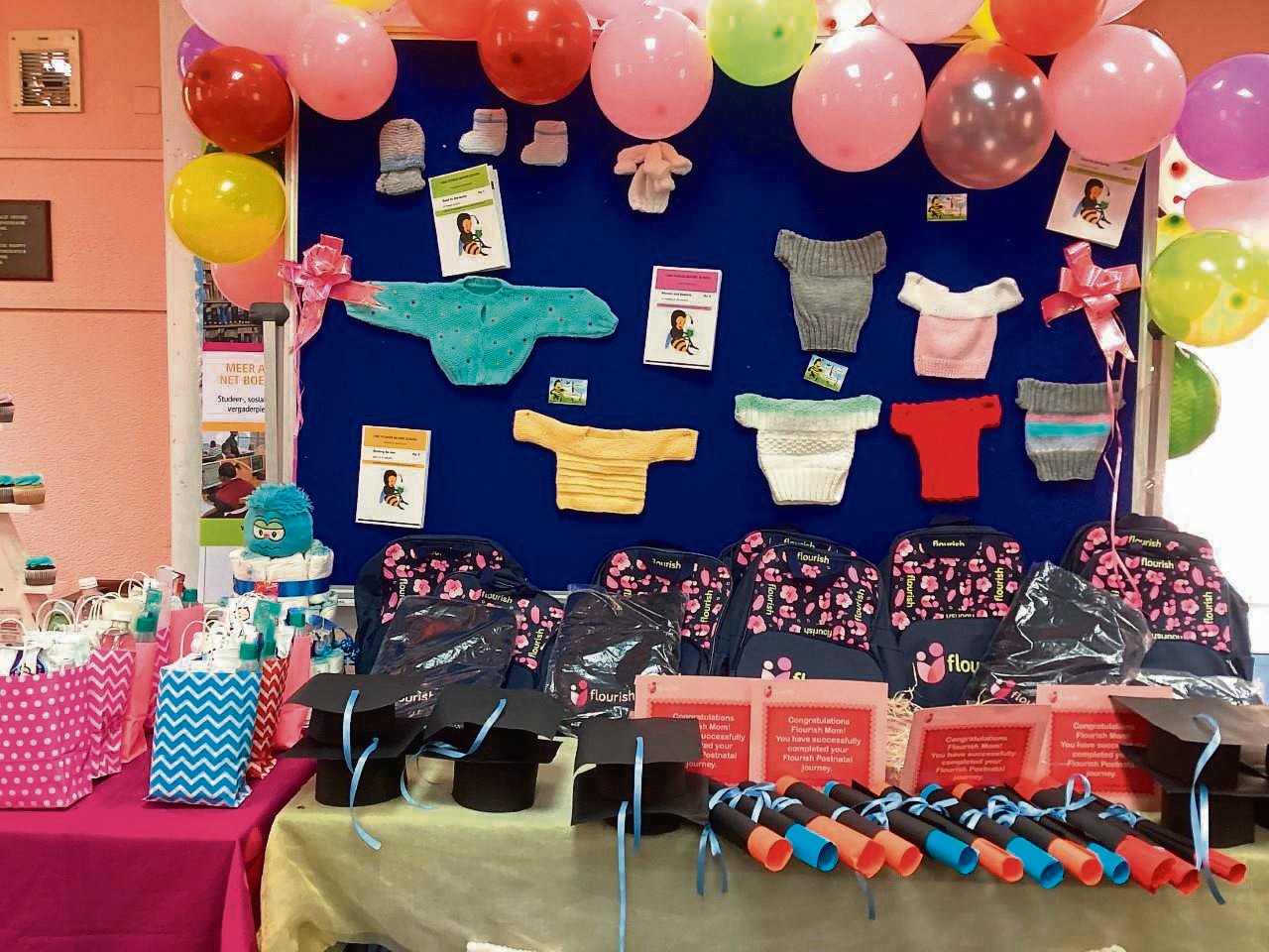 An exhibition of baby goods and a goodie-bag on display from one of the three previous baby showers and workshops/graduations held at Hanover Park the past year.