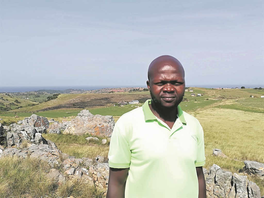 Sibusiso Mqadi, anti-Xolobeni mining activist and chairman of the Amadiba Crisis Committee which opposes mine in the area. Behind him is the area which had been earmarked for the controversial mining project. Picture: Lubabalo Ngcukana/ City Press