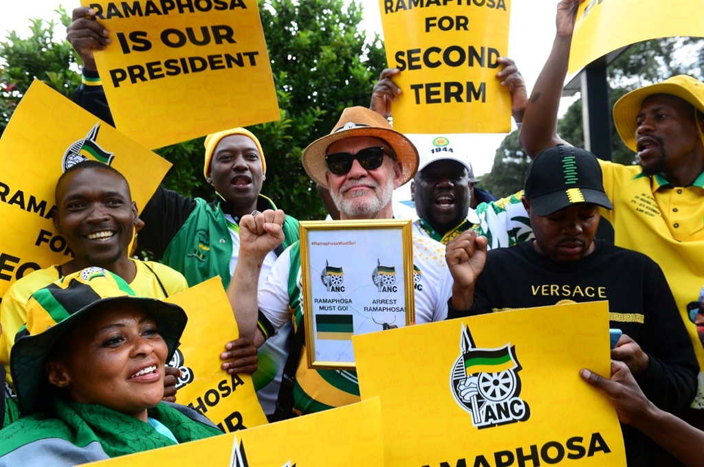 Suspended ANC member Carl Niehaus sandwiched by President Cyril Ramaphosa's supporters at NASREC. Photo by Morapedi Mashashe.