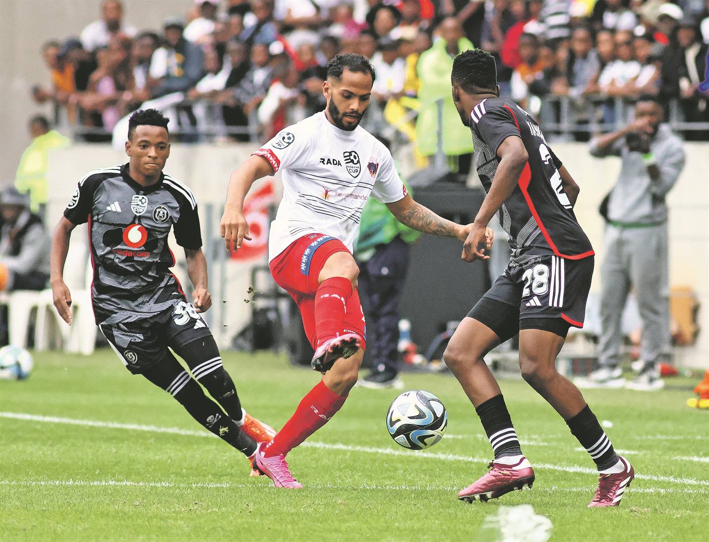 Sirgio Kammies of Chippa United is sandwiched between the Orlando Pirates duo of Relebohile Mofokeng and Patrick Maswanganyi during their Nedbank Cup semifinal at Nelson Mandela Bay Stadium in Gqeberha, Eastern Cape yesterday 