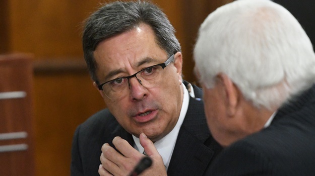 markus Jooste consulting with his lawyer Francois 
