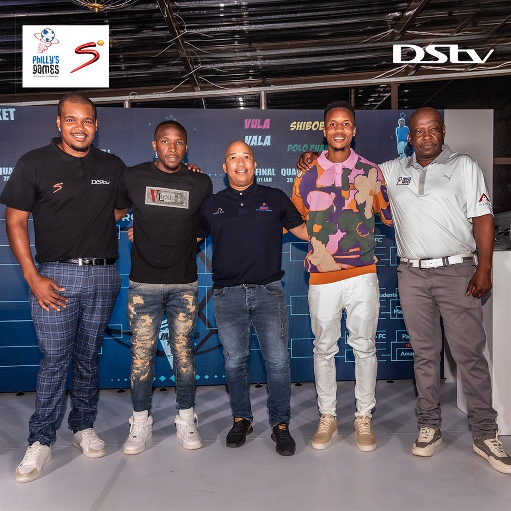 AmaZulu player George Maluleka (second) and Themba Zwane (fourth from left) are flanked by DStv’s sponsorship senior manager Tshepiso Sathekge and representatives from Philly's Games during the tournament's draw in Tembisa on Thursday. Photo: Supplied.