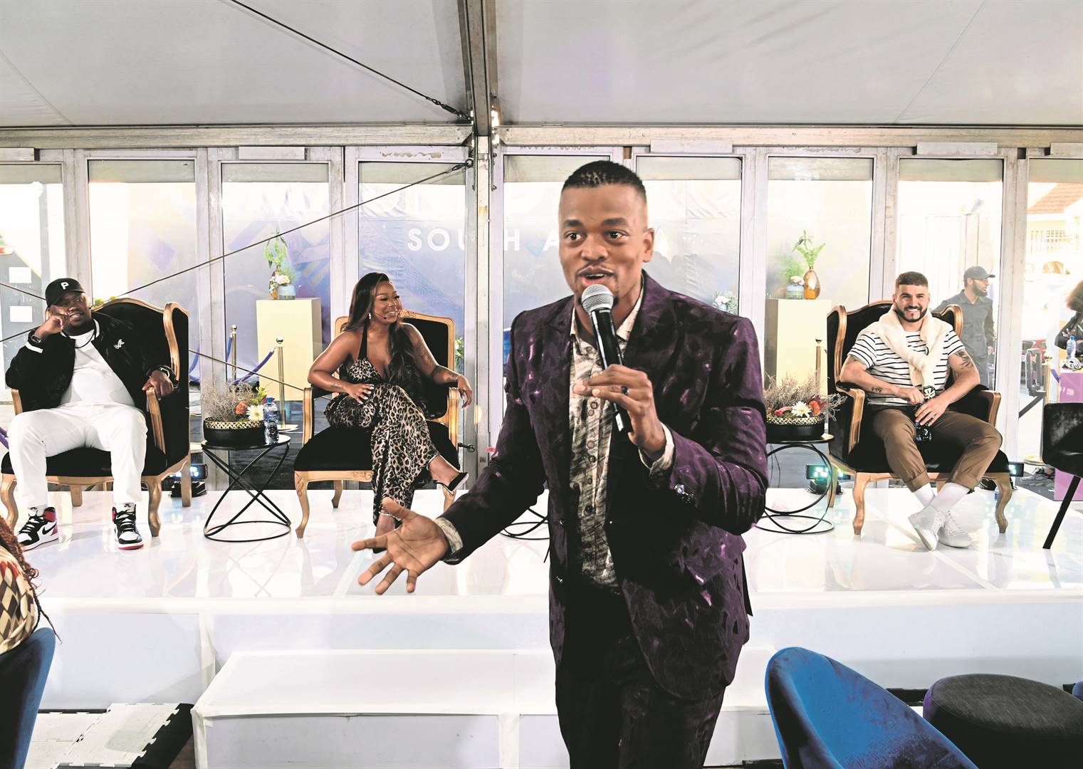 The overused comedian, Mpho Popps, launches The Masked Singer SA, a show in which the judges and audience do their best to identify a disguised singer.