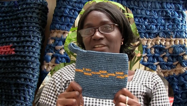Isatou Ceesay with one of the bags she makes