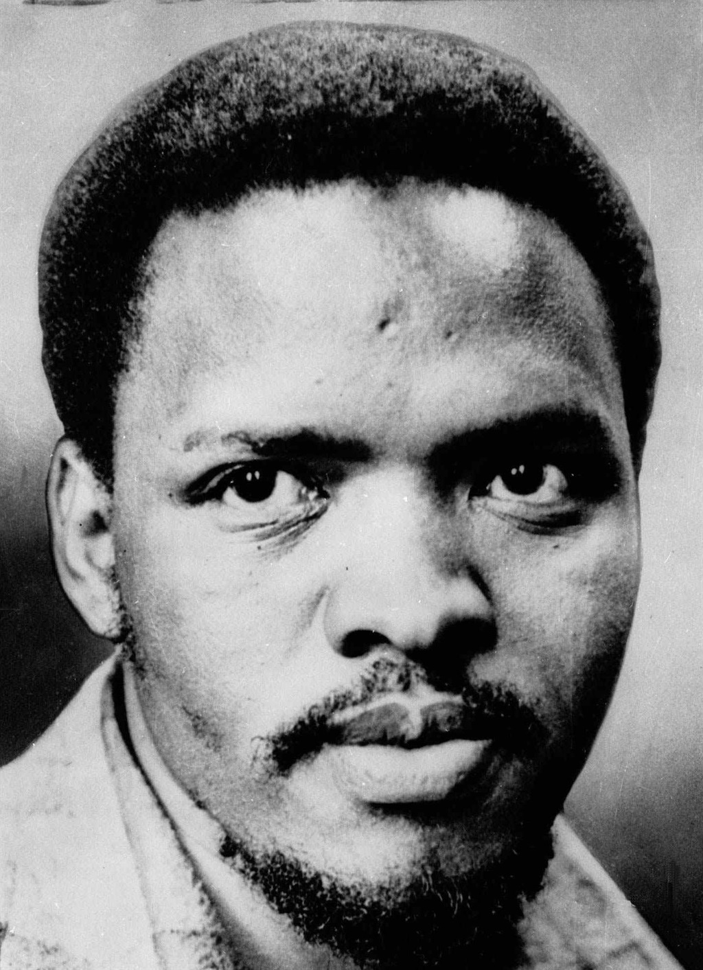 SW20000802INT024:GENERIC:NOCATEGORY:01JAN1980 - AP97091126:INTERNATIONAL:POLITICS:TERRORISM:FUNERALS:POLICE:11SEP97 - Steve Biko, South Africa's Black pride leader who was killed in 1977, is seen in this undated file photo. Police slammed Steve Biko&#x573; head into a wall, chained him crucifixion style to a gate for 24 hours, then covered up the truth about his death, one of the officers admitted Wednesday Sept. 10, 1997. Col. Harold Snyman, squirmed, stammered and looked anywhere but forward as he recounted the 1977 killing of the black pride leader in a bid to win amnesty from South Africa&#x573; Truth and Reconciliation Commission. (AP Photo/FILE ) VERTICALPHOTO: 