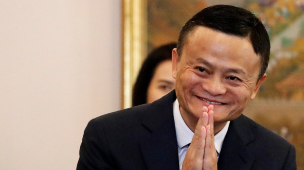 Alibaba founder Jack Ma gestures as he arrives for a meeting in Thailand (AFP)