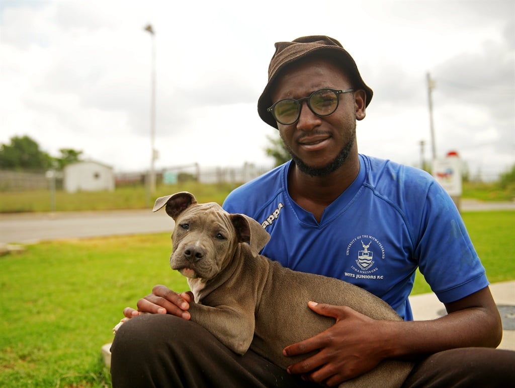 Zwelibanzi Dube, a dog breeder, with his pit bull puppy. Photo: Tebogo Letsie/City Press