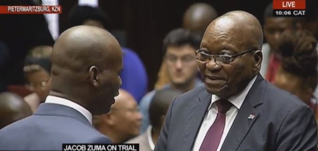 Zuma appears to be in a jovial mode as he chats with counsel


