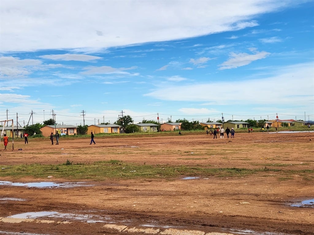 Children play on a soccer field in Blyderville aft