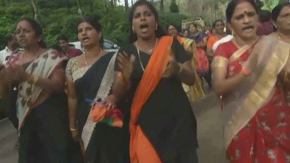 Women protesting outside a temple