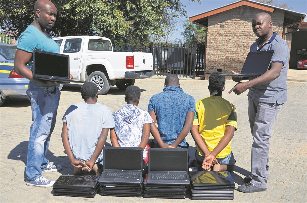 Four suspects were arrested by Detective-Constable Light Mathebula and Detective-Sergeant Collen Nyalungu for stealing 20 laptops from a school.         Photo by Oris Mnisi 