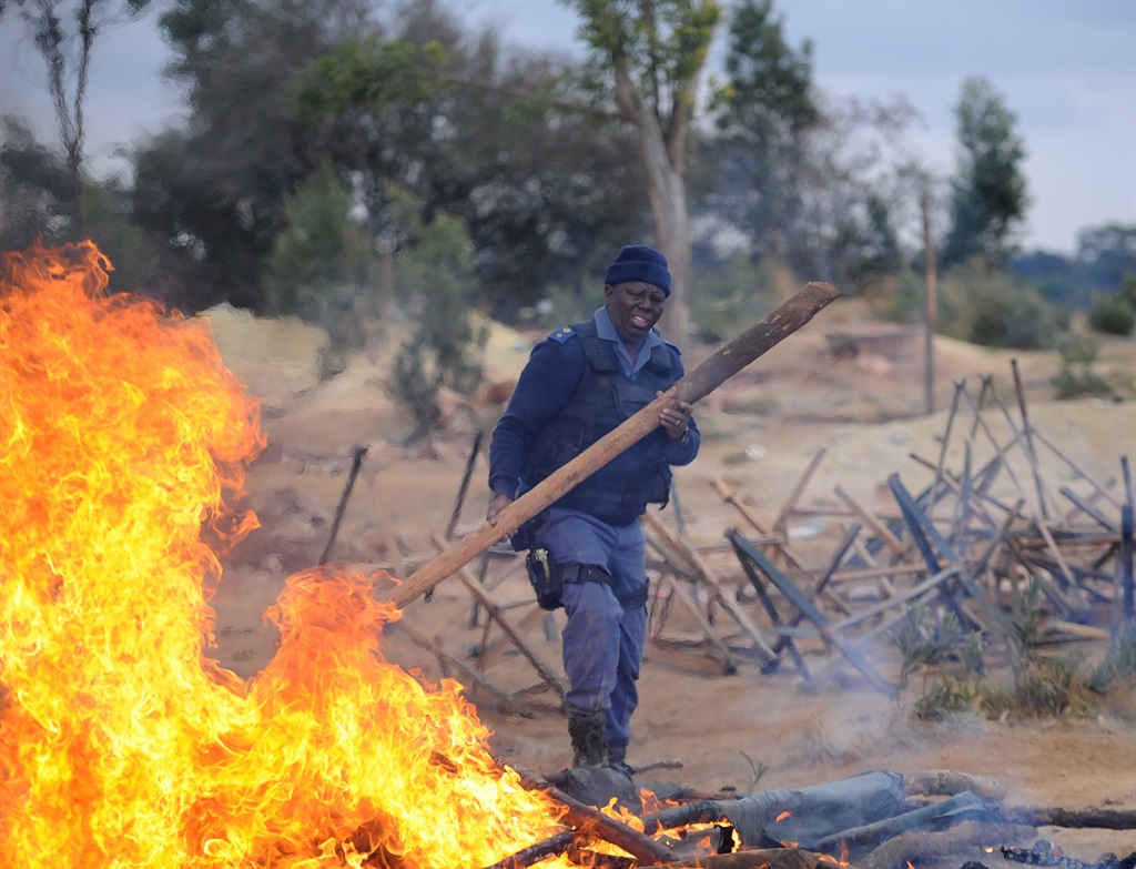 After eight women were allegedly gang-raped outside Krugersdorp in July, police conducted a raid at the West Village mine tailings dump in Krugersdorp, seizing equipment and destroying the makeshift structures zama zamas were allegedly using. The rapes were blamed on illegal miners. Photo: Tebogo Letsie/City Press
