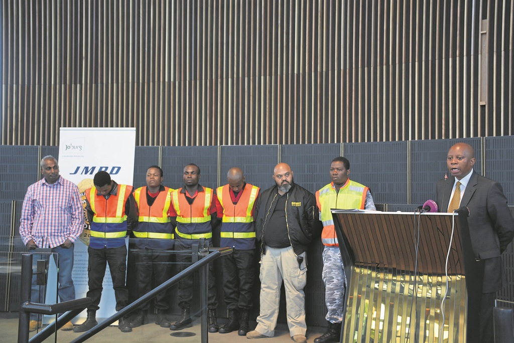 Joburg mayor Herman Mashaba (right) honoured members of Bad Boyz security company who arrested a suspect for gunning down of an off-duty Metro cop. Photo by Sthembiso Lebuso