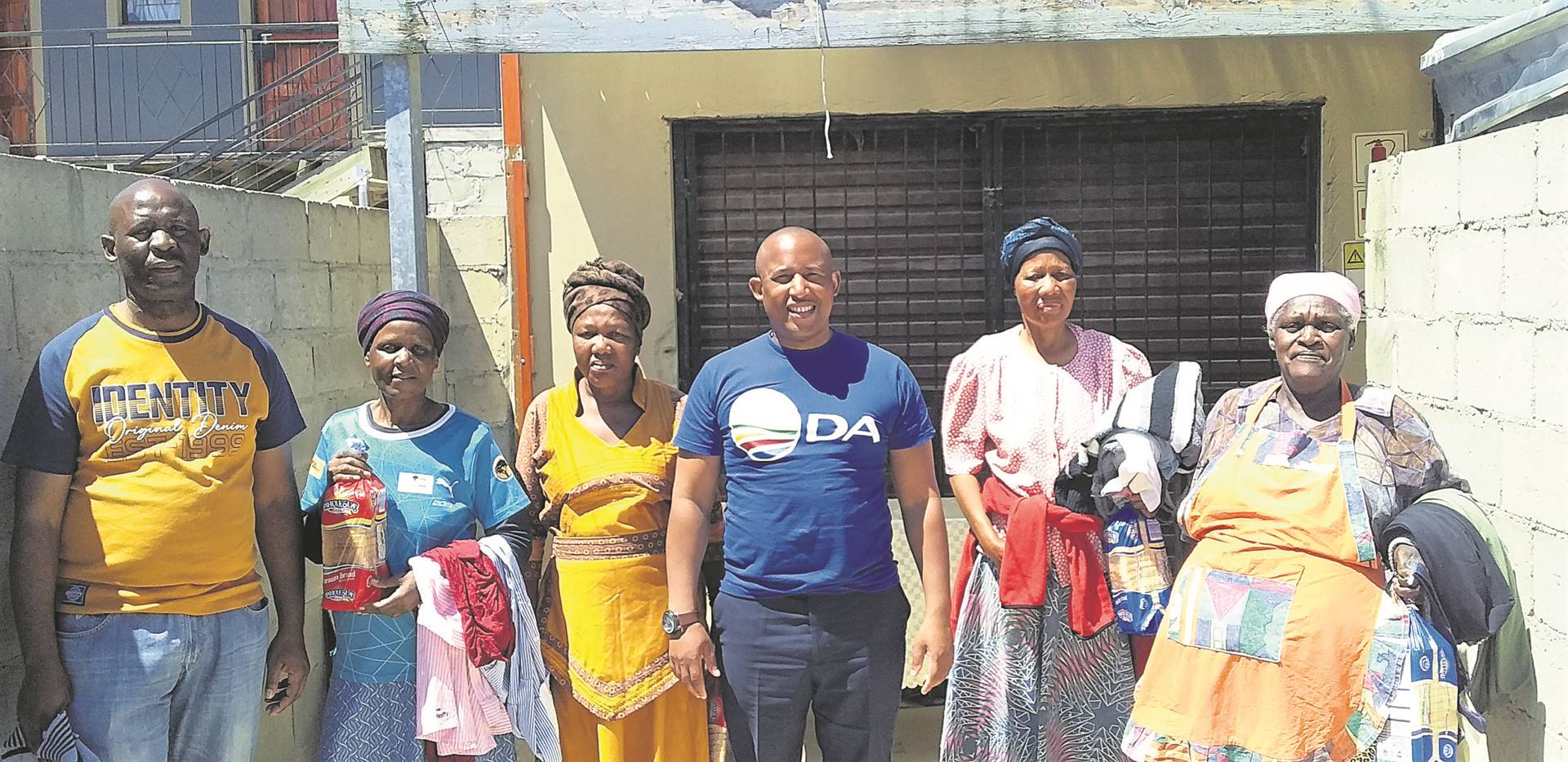 Proportional representative councillor Unathi Lasithi (centre) participated in the distribution of hampers to the elderly in Nomzamo and Lwandle in the spirit of the festive season. The hampers included towels toiletries and were handed out in Simon Street on Wednesday 7 December. Pictured with Lasithi are some of the grateful beneficiaries.